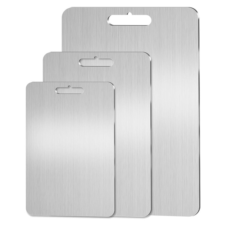 Three titanium cutting boards on a white background