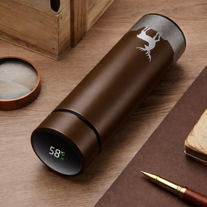 Brown thermos bottle with digital temperature display on a wooden surface
