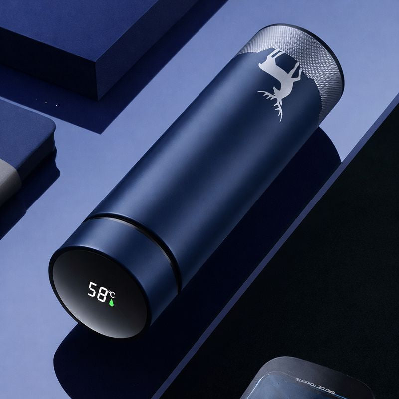 Blue thermos with digital temperature display on a reflective surface