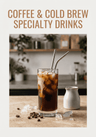 Iced coffee with a metal straw in a glass on a wooden table, with text 