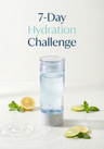 Hydration challenge bottle with lemon and lime slices on a white background