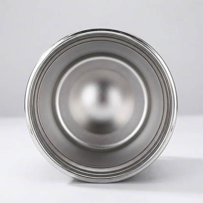 Metallic lid on a light gray background