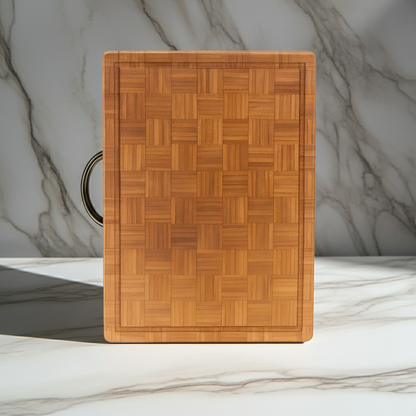 Wooden cutting board with a herringbone pattern on a marble surface