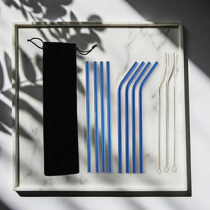 Set of blue and clear straws with a black carrying case on a marble surface.