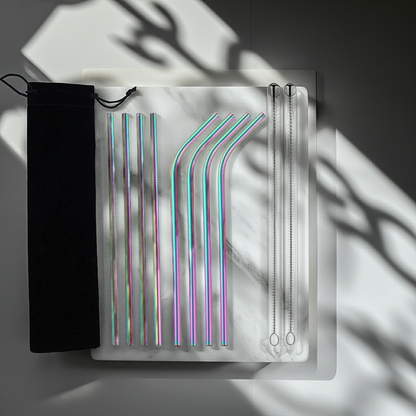 Set of colorful metal straws in a clear packaging on a dark background
