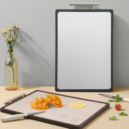 Titanium cutting boards on a table with one up right against a wall